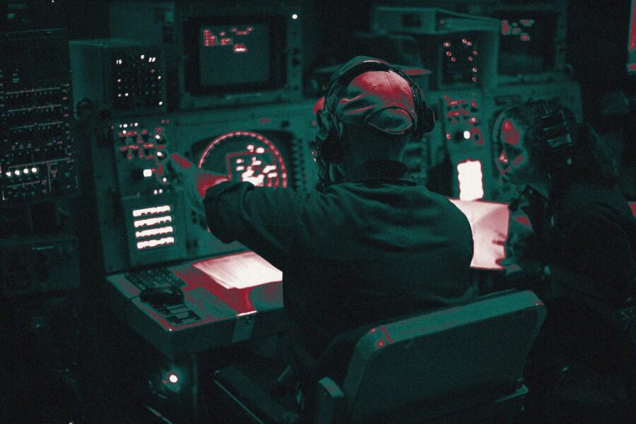 An operations specialist at a radar console