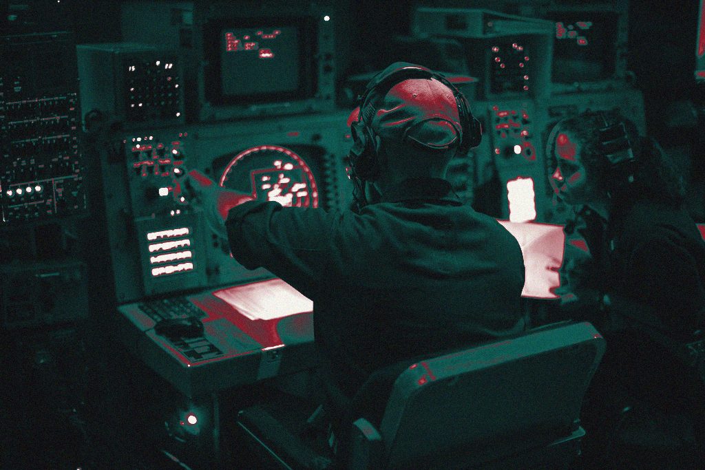 An operations specialist at a radar console