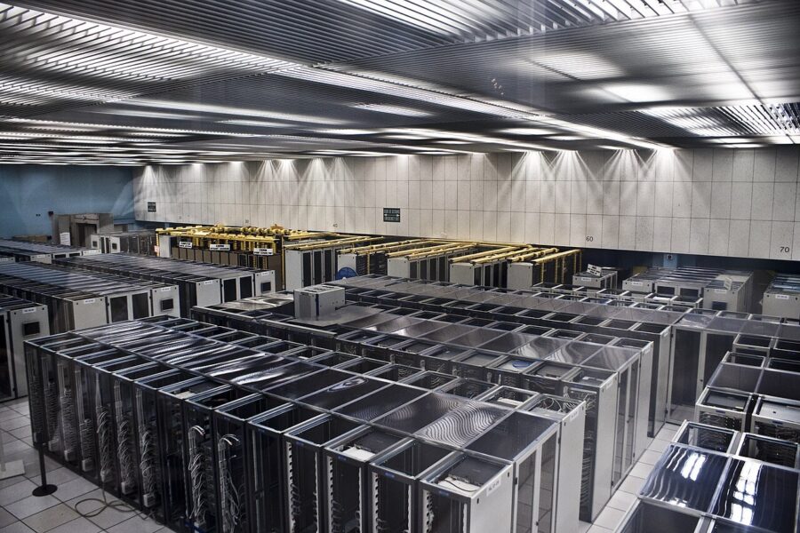 Rows of server racks in a data-centre server room