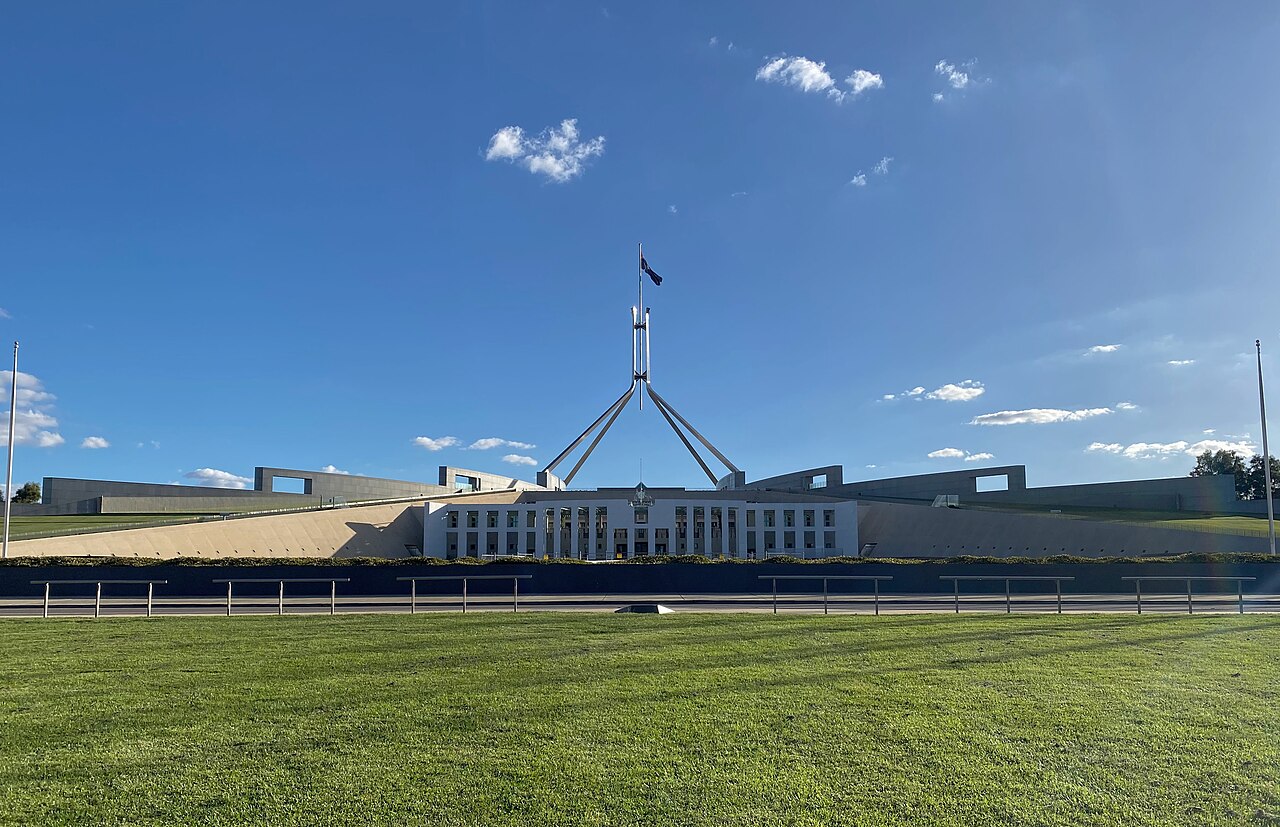 Parliament House, Canberra, seat of the Australian Parliament whose AI committee heard OpenAI's apology this week (illustrative; the hearing was held in Sydney).